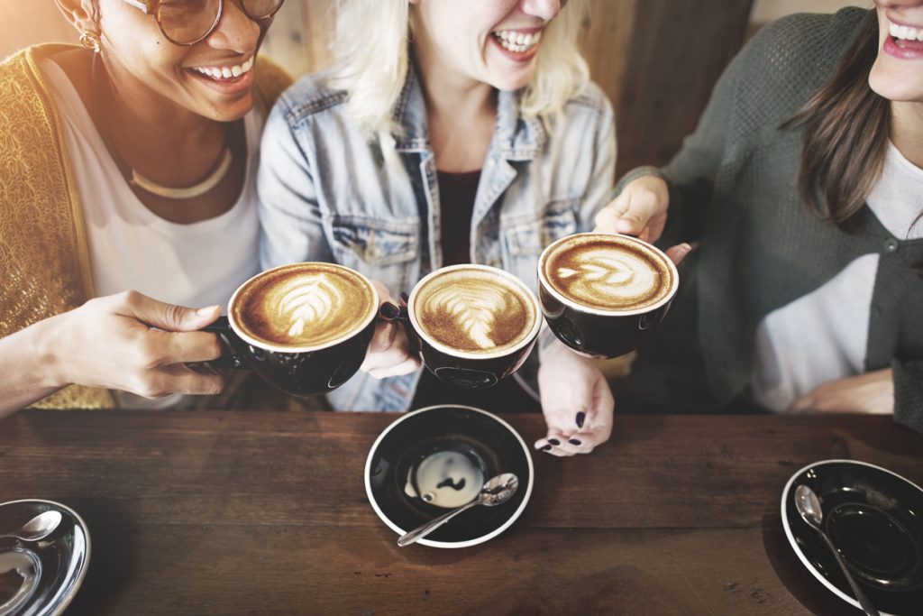 3 women enjoying coffee in one of the coffee shops in Denver