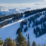 snowy mountains ski hill with pine trees