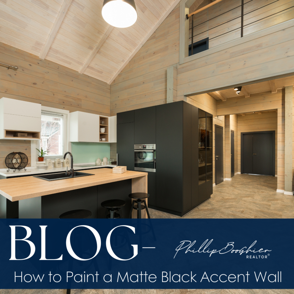 Modern kitchen with a matte black accent wall and natural wood finishes, highlighting a bold and sophisticated interior design