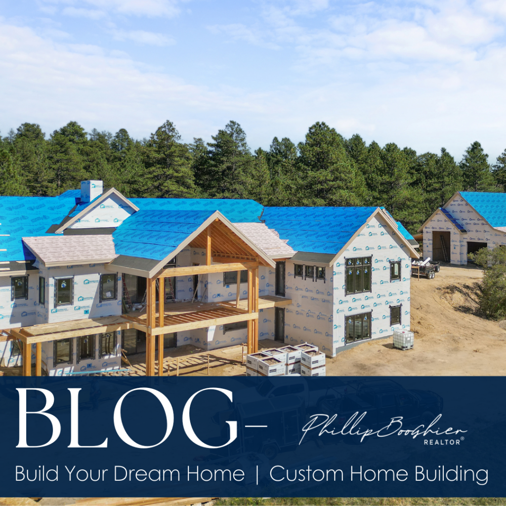 Custom home under construction in Colorado, surrounded by pine trees, showcasing the early stages of building with a focus on the roof and outdoor structure