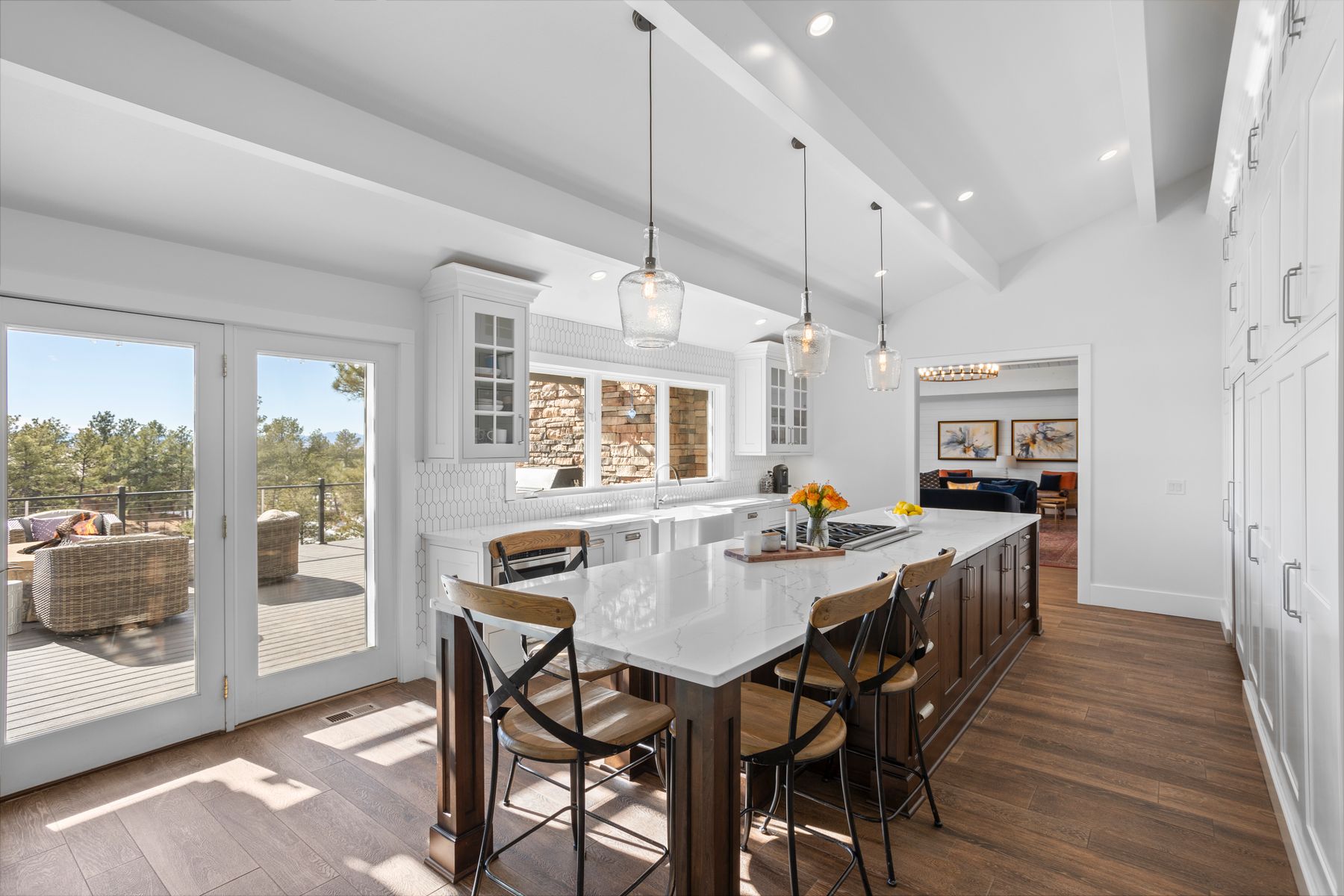 Modern chef's kitchen at 8740 Hilltop Road with quartz countertops, custom cabinetry, and Monogram appliances