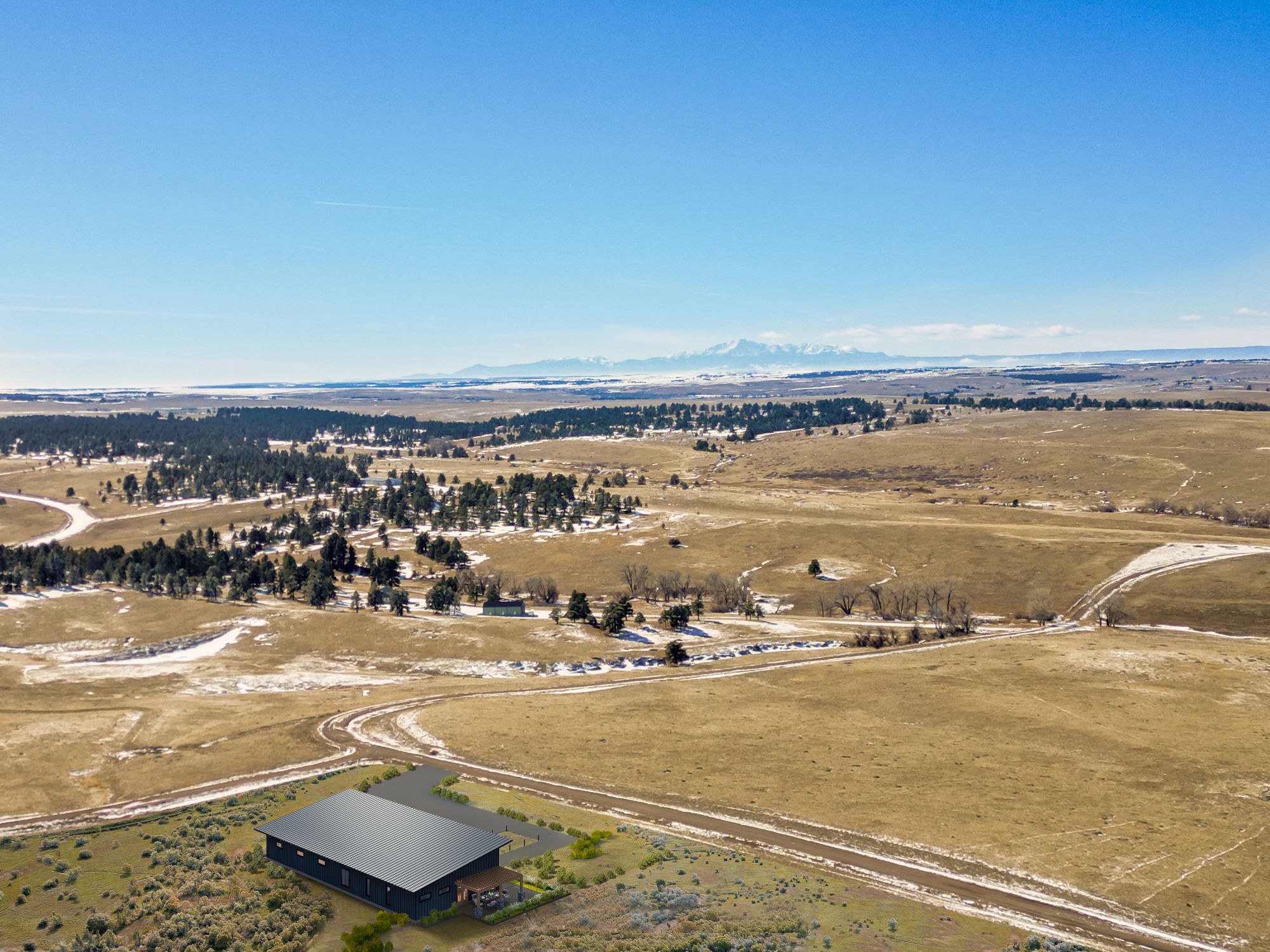Open prairie land in Kiowa, Colorado, featuring wide-open views under a blue sky—ideal for building a custom home or equestrian estate.