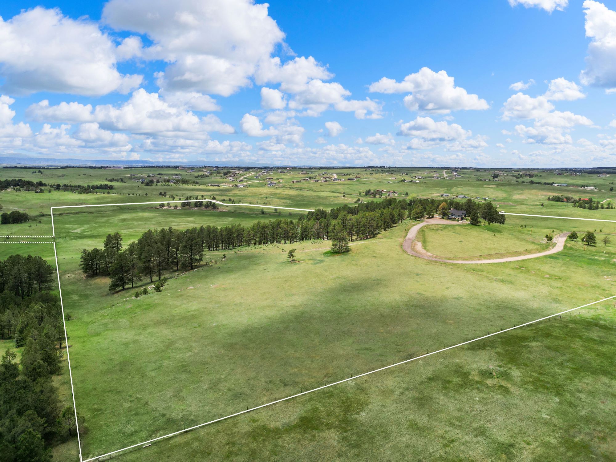 Gorgeous Elizabeth, Colorado ranch property with trees, open pasture, and rolling hills—ideal for private living, recreation, or agricultural use.