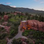 The Rock House in Larkspur, Colorado — 6619 Apache Place, Larkspur, Colorado. Modern luxury home built into massive red rock formations with panoramic mountain views with mountain views and unique natural surroundings