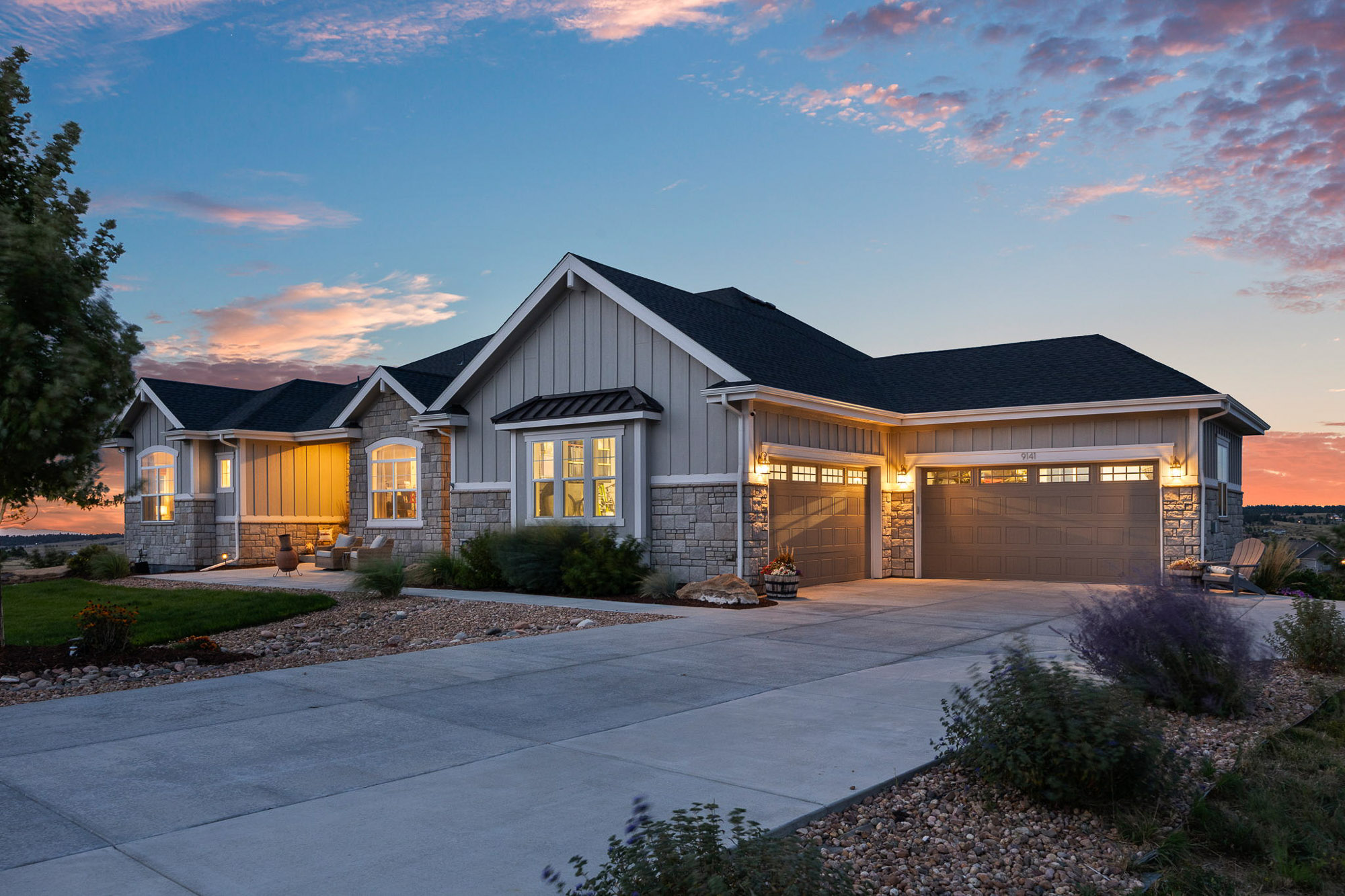 Front exterior of the Franktown 8-acre estate at 9141 Red Primrose Street showing modern farmhouse design and four-car garage.
