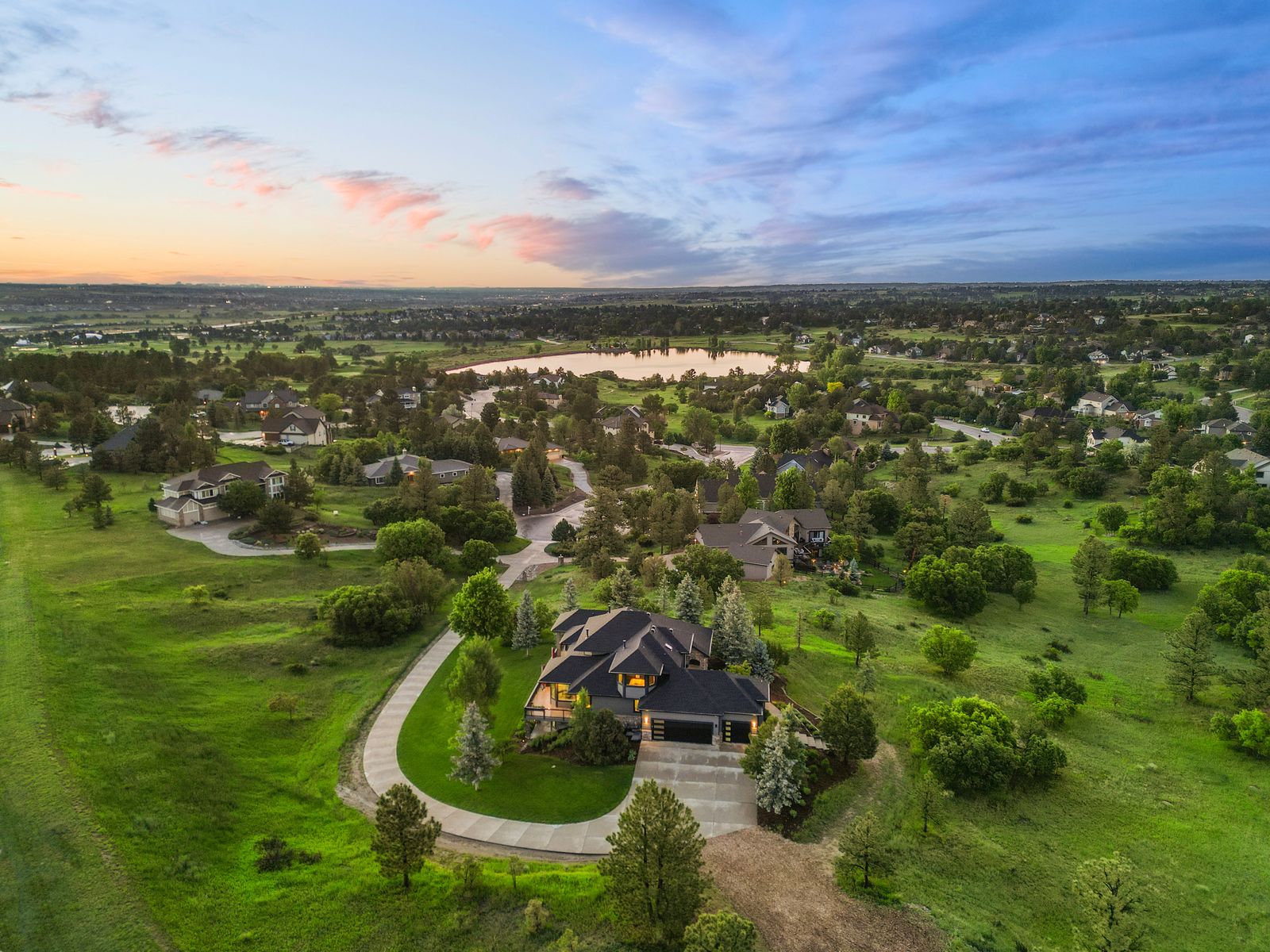 Aerial view of a home among ponderosa pines in The Pinery, Parker, Colorado